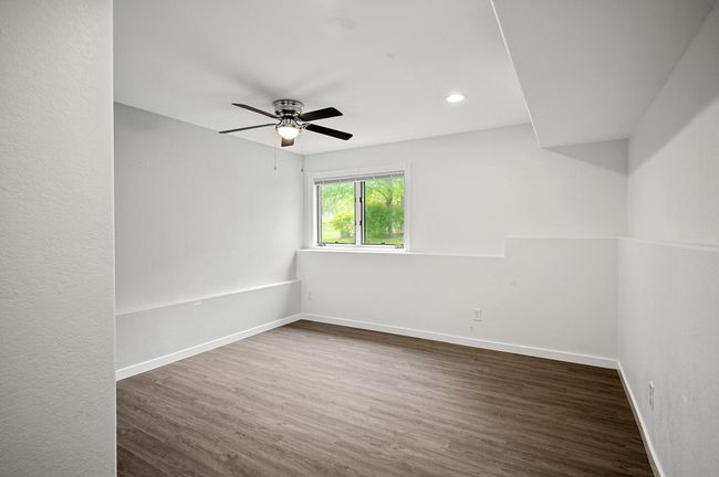Head to the lower level, and you will find the fourth bedroom! | Image 22