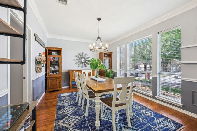 The spacious formal dining is bathed in natural light. | Image 5