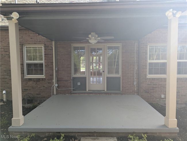 View of patio / terrace with a ceiling fan | Image 18