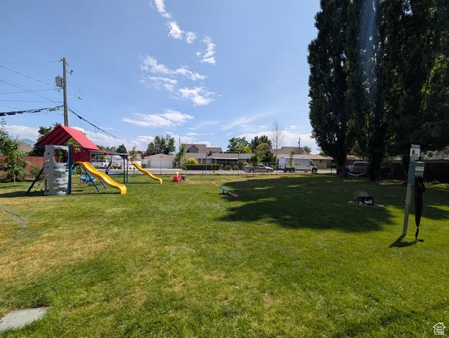 View of yard featuring a playground | Image 34