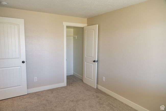 Unfurnished bedroom with carpet and a closet | Image 28