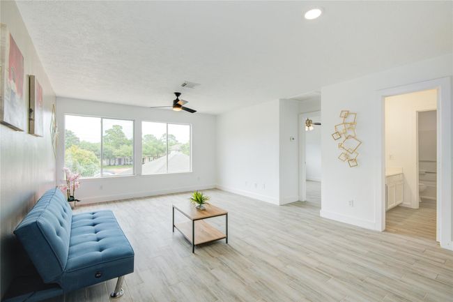 Spacious Gameroom with accent wall | Image 21