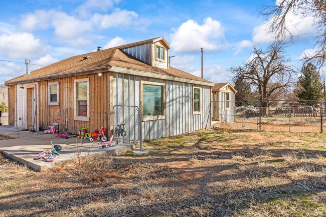 View of side of home with a shingled roof | Image 31