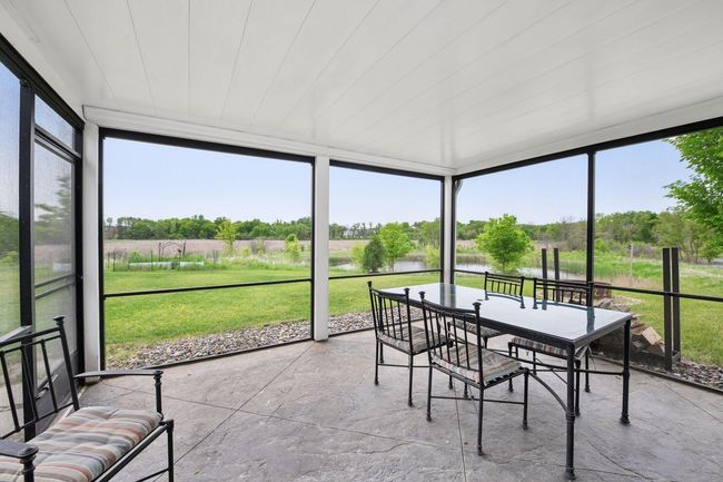 Enjoy the peaceful views from the screened in porch | Image 40