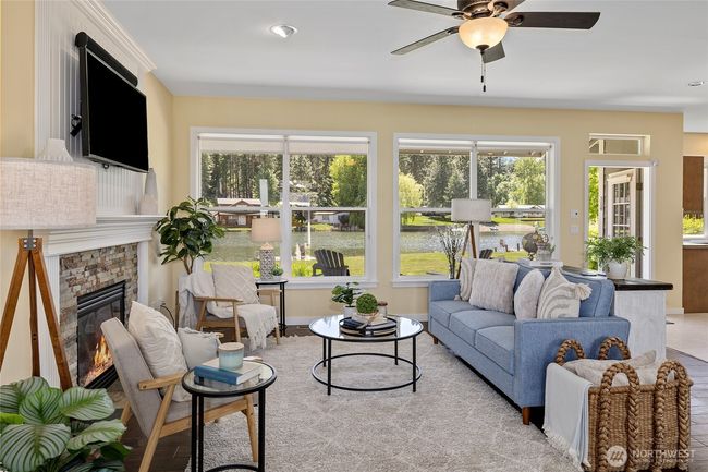 Large living room, cozy fireplace and views to the lake. | Image 6