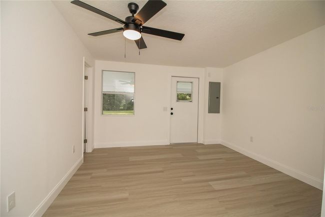 Primary bedroom with en suite half bath and walk in closet | Image 12