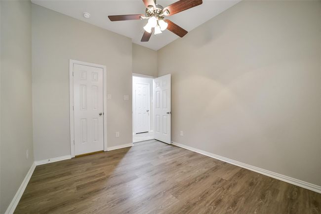 Bedroom 3 also has a walk-in closet and more of the luxury vinyl plank flooring. | Image 26