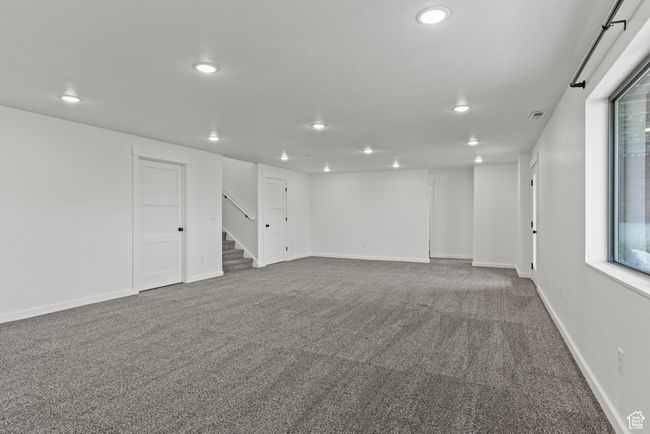 Finished below grade area featuring recessed lighting, carpet, stairs, and baseboards | Image 31