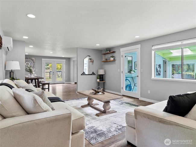 One of two living areas with pool access adjacent. | Image 6