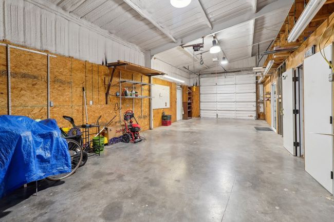 Garage with metal wall and a garage door opener | Image 26