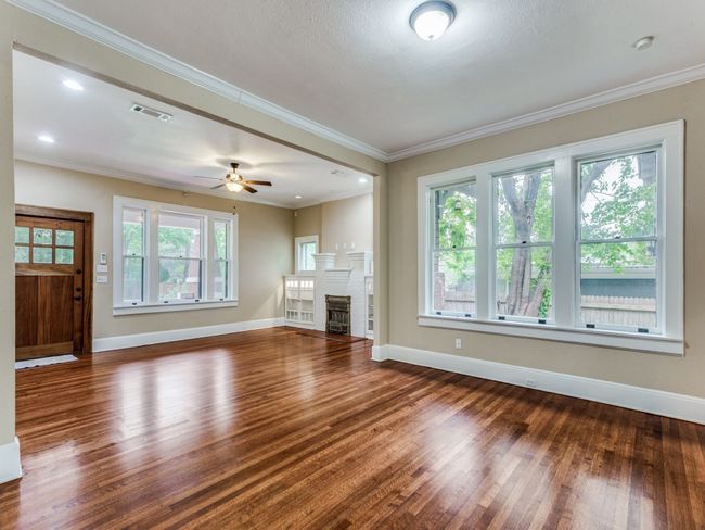 Walls of windows bring in the natural light and charm when you enter the home | Image 4