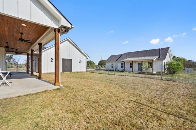 View of yard with a ceiling fan and a patio | Image 27