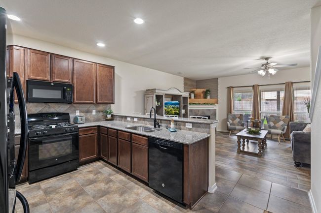 Nice open kitchen that overlooks the living room. | Image 10