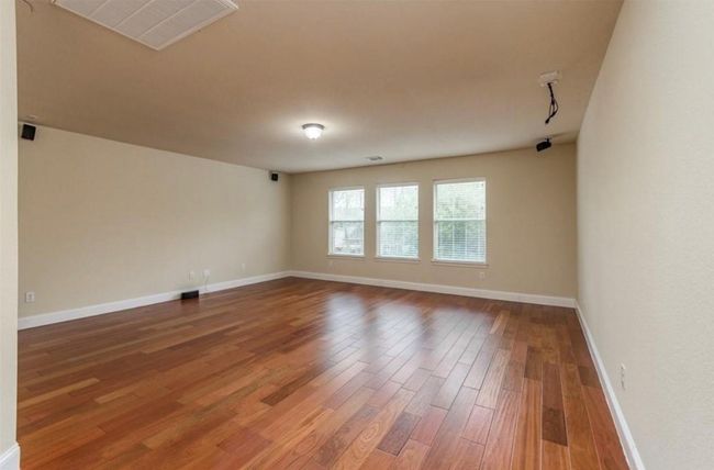 Empty room featuring hardwood / wood-style flooring and baseboards | Image 20