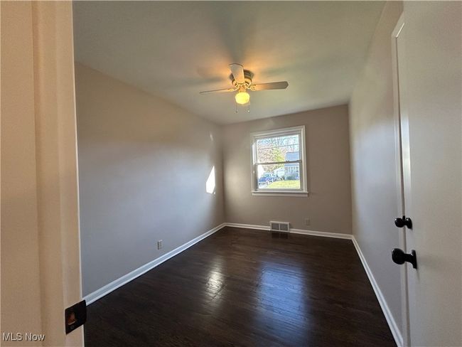Third Bedroom with a ceiling fan and dark wood-style flooring | Image 25