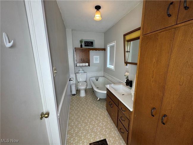 First floor bathroom with vanity and tile patterned floors | Image 19