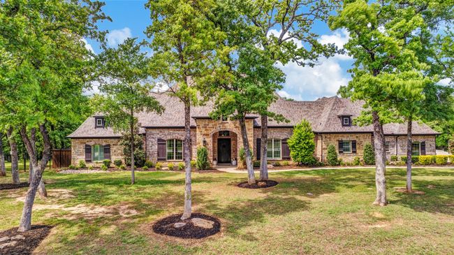 Welcome to 521 Waters Edge, a sprawling home on a nearly 2 acre heavily wooded lot in coveted Gates at Waters Edge community! | Image 4