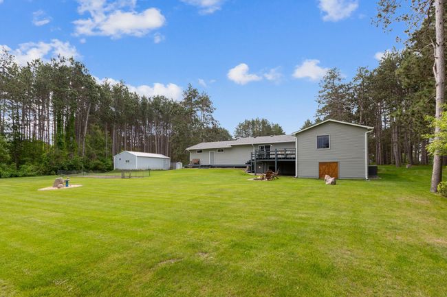 Look at all that green space. Flat, easy mow lawn surrounded by tall pine trees. | Image 36