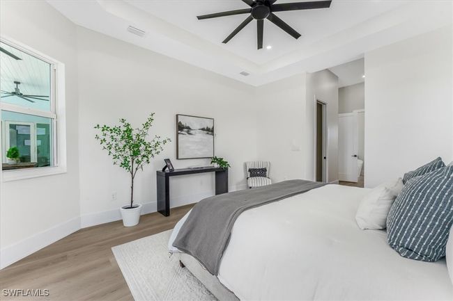 Bedroom with light wood-style floors, recessed lighting, and ceiling fan | Image 11