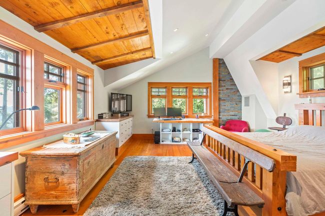 Bedroom featuring hardwood / wood-style flooring, baseboards, wood ceiling, and baseboard heating | Image 20