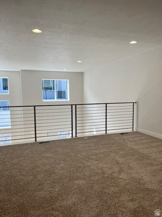 Carpeted spare room featuring baseboards and recessed lighting | Image 6