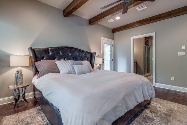 Bedroom featuring beamed ceiling, ceiling fan, and dark hardwood / wood-style floors | Image 13