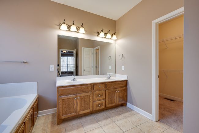 His and hers sinks with additional walk-in closet. | Image 21