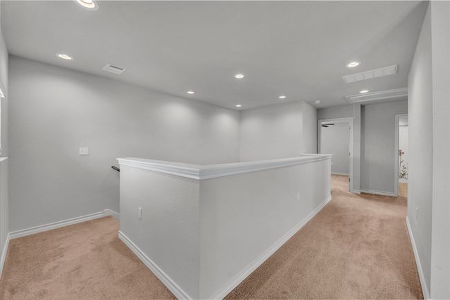 Hall with an upstairs landing, carpet, recessed lighting, and baseboards | Image 16