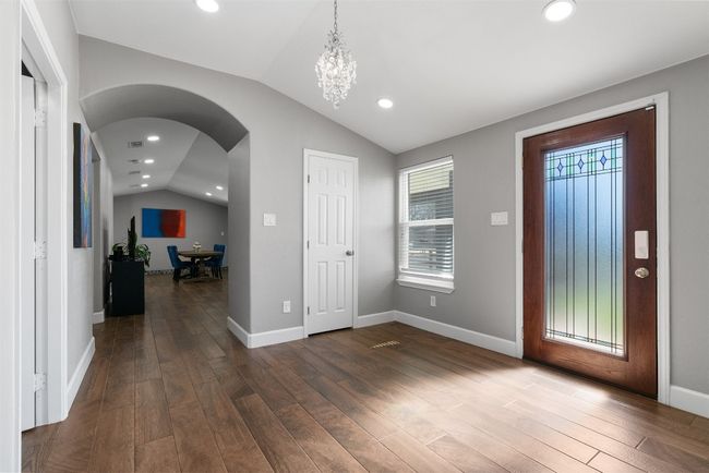As soon as you step through the door, natural light floods the open living spaces, casting a warm glow on the thoughtfully chosen colors that breathe life into each room | Image 4