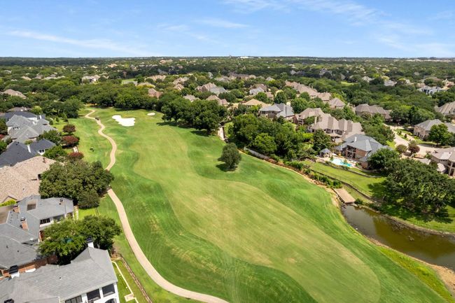 Aerial overview of property's location with nearby suburban area, a nearby body of water, and a local golf course | Image 40