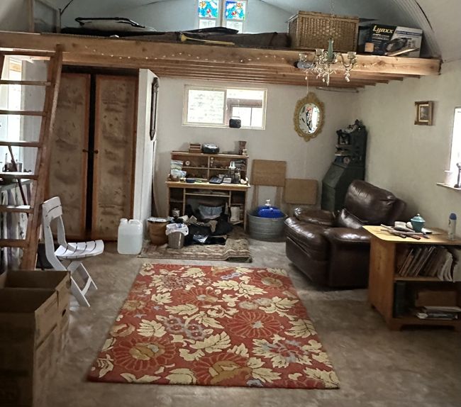 Woodstove area looking back into entry/first room | Image 10