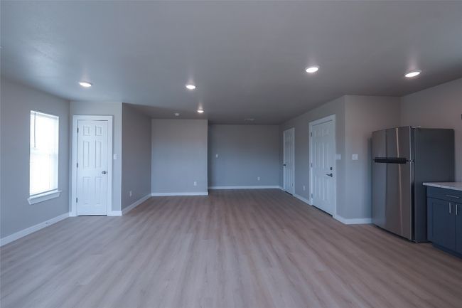 Unfurnished living room featuring recessed lighting and light wood-style floors | Image 10