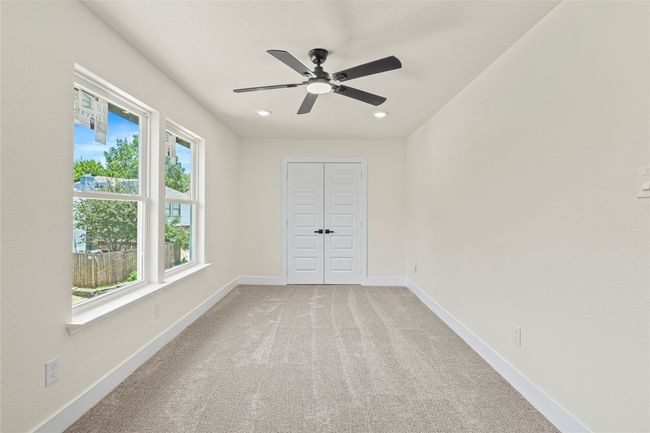 Unfurnished room with ceiling fan, recessed lighting, and light carpet | Image 17