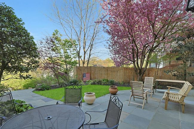 Fenced backyard featuring outdoor dining area and a patio | Image 29