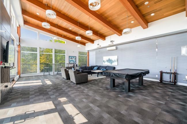 Game room with beamed ceiling, wooden ceiling, carpet floors, and pool table | Image 25
