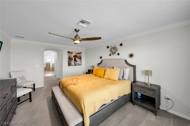 Carpeted bedroom with ornamental molding and ceiling fan | Image 40
