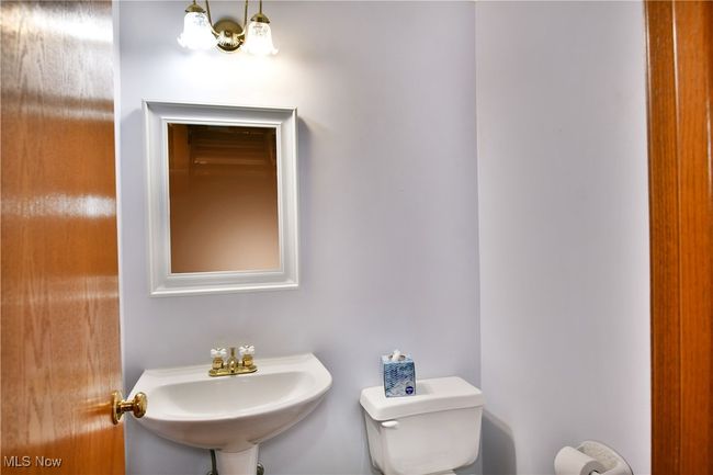 Bathroom featuring toilet and a sink | Image 19