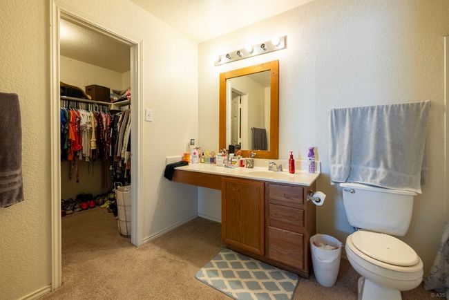 Bathroom featuring vanity and a spacious closet | Image 11