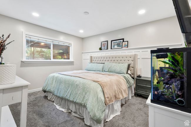 Bedroom with light colored carpet and recessed lighting | Image 22
