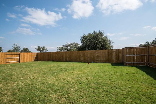 View of yard with a fenced backyard | Image 25