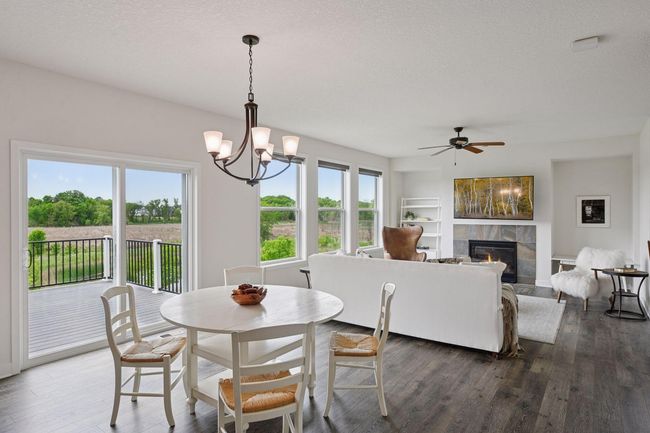 The dining room opens up to the maintenance free deck | Image 12