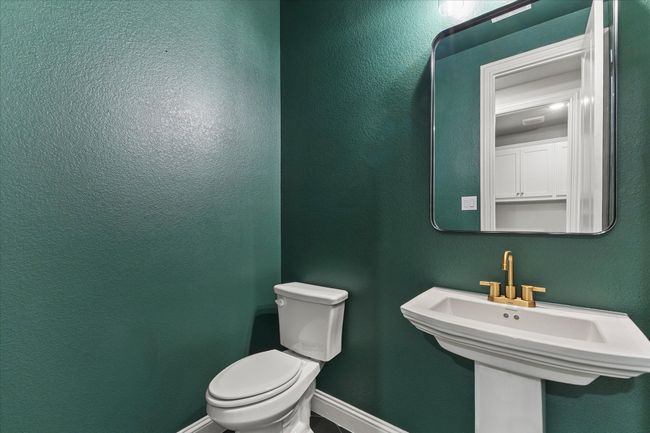 Half bath with toilet and a sink | Image 8