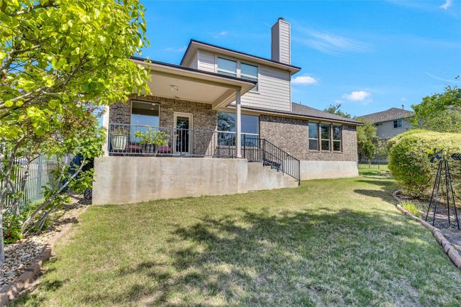 Back of property with brick siding and iron fence | Image 31
