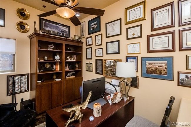 Office featuring a ceiling fan | Image 56