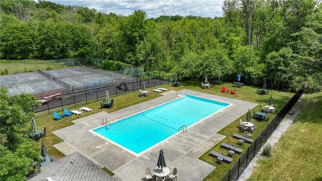 View of swimming pool with and tennis courts | Image 27