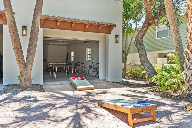 Utilize the garage as a game room and extra storage | Image 41
