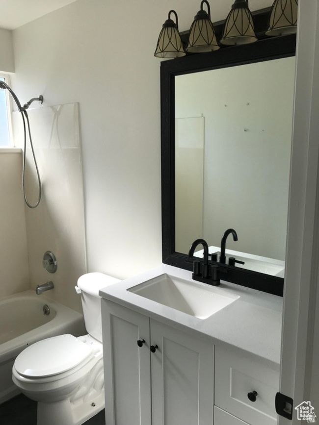 Bathroom featuring vanity and bathing tub / shower combination | Image 13