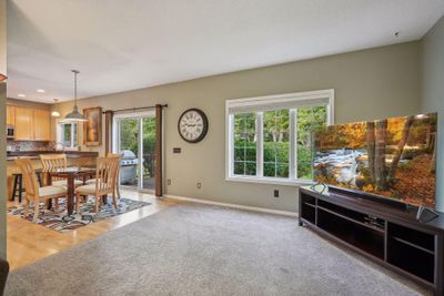 The living room flows into the informal dining area | Image 3