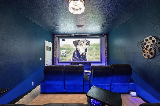 Incredible second floor media room with HD projector, built in seating with SOUNDSHAKERS for the ultimate entertainment experience! | Image 21