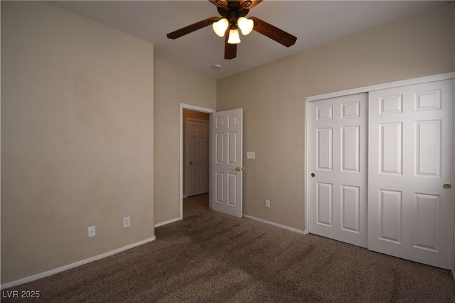 Unfurnished bedroom featuring carpet, a closet, baseboards, and ceiling fan | Image 18